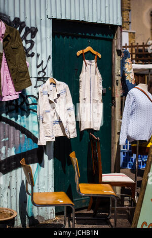 Vintage and secondhand clothes and objects jostle for space athe Columbia Road Flower Market, London Stock Photo