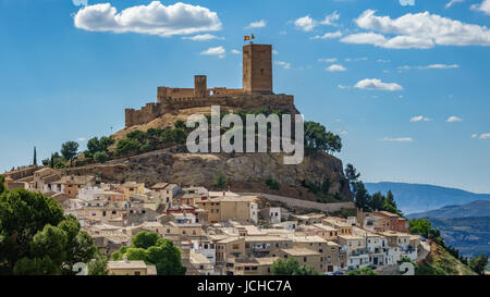 Top of the hill with Biar castle and town at dusk in Alicante, Spain Stock Photo