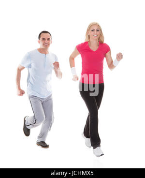 Fitness couple running towards camera. Isolated on white Stock Photo