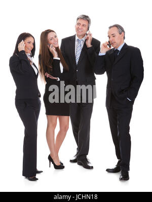 Group Of Businesspeople Gossiping Over White Background Stock Photo