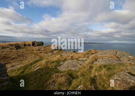 Cliiff at Fair Head, County Antrim, Northern Ireland. Rathlin Island is visible from the cliff, across the Sea of Moyle. Stock Photo