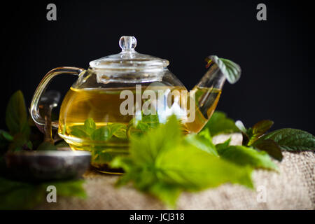 tea with currant leaves on a black background Stock Photo