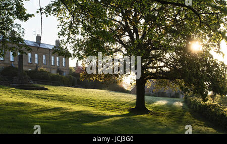 Blockley village green in early morning spring sunshine. Cotswolds, Gloucestershire, England Stock Photo