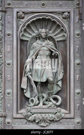 Sculpture of St. Michael the Archangel with a sword and libra striking ...
