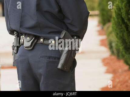 Equipment belt with gun and handcuffs on NYPD police woman Stock Photo ...