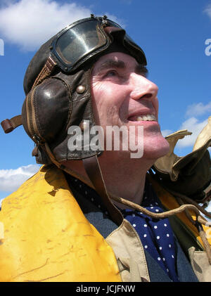 Battle of Britain RAF Pilot re-enactor in authentic original and accurate Flying Kit looking skyward Stock Photo