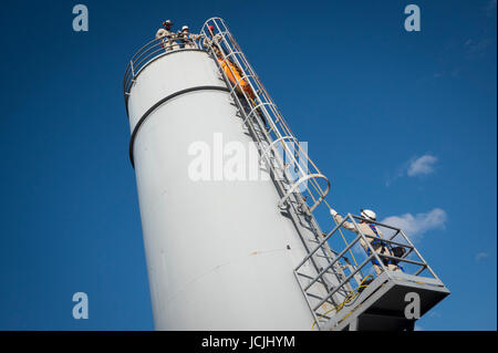 Crews practice high angle rescue at a public training facility at an industrial site in Oregon using ropes, litters and rappelling techniques. Stock Photo