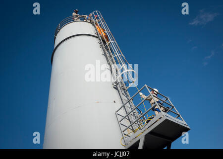 Crews practice high angle rescue at a public training facility at an industrial site in Oregon using ropes, litters and rappelling techniques. Stock Photo