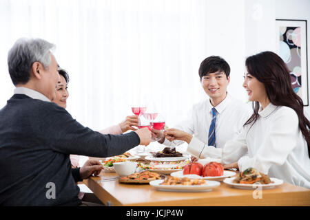 Portrait of harmonious family having meals Stock Photo