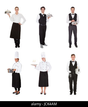 Young Group Of Waiters And Waitress Over White Background Stock Photo