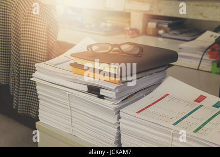 Pile of unfinished documents on office desk, Stack of business paper, Vintage Effect Stock Photo