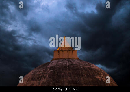 Stupa temple with stormy weather Stock Photo