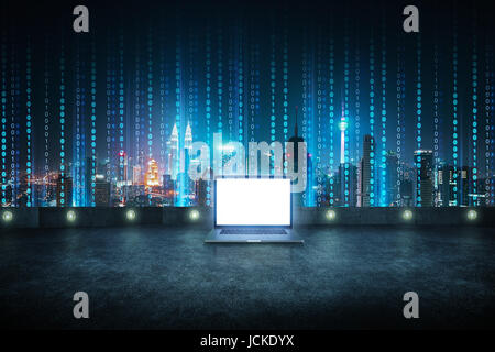 Laptop at roof top with abstract software developer programming binary computer code virtual city skyline . Stock Photo
