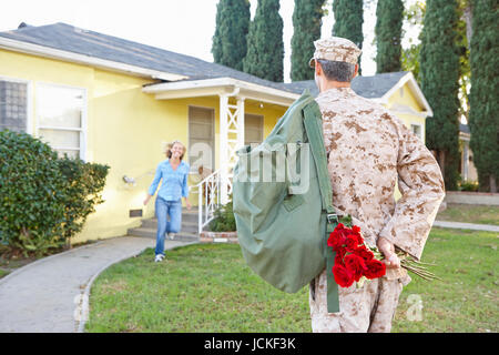 Wife Welcoming Husband Home On Army Leave Stock Photo