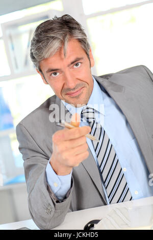 Businessman giving product advantages to client Stock Photo