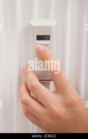 Close-up of pressing timer button on electric stove. Action. Finger ...