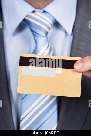 Cropped image of businessman giving credit card Stock Photo