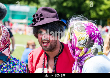 England, Coxheath. World custard pie championships. One of the Grannies team chatting, man dressed as woman with hat on. Stock Photo