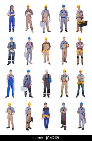 Full length of confident multiethnic engineers standing against white background Stock Photo