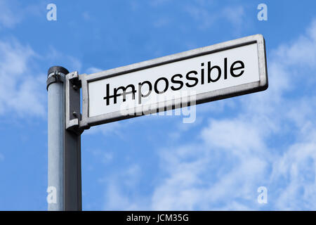 Low angle view of signpost with Possible sign against sky Stock Photo