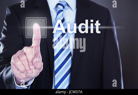 Midsection of businessman touching Audit button on virtual screen Stock Photo
