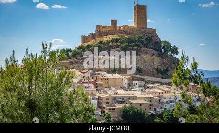 Top of the hill with Biar castle and town at dusk in Alicante, Spain Stock Photo