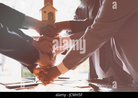 House developer and businessman shaking hands after finishing up a business meeting. Architect and engineer handshaking after a conference and have ag Stock Photo