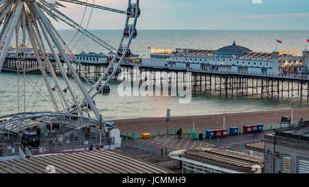The Victorian Brighton Pier, also known as the Palace Pier and the Brighton wheel at sunset Stock Photo