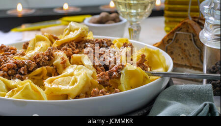 Close up view of delicious steamy tortellini in bolognese sauce (pasta) Stock Photo
