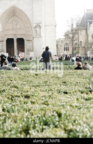 Man standing outside Notre Dame. Paris, France. Stock Photo