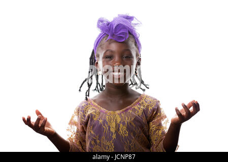 Beautiful portrait of a happy African  little girl smiling with open arms in purple costume on white background Stock Photo