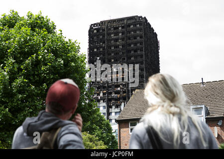 London, UK. 16th June, 2017. The Grenfell Tower Disaster, in West London. A 24 story residential building destroyed by fire.   Social housing, social housing estate, tower block london, tower block uk, high rise cladding, building regulations uk, building regulations in uk. Tower block fire. Stock Photo