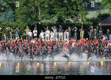 Rutland Water, UK. 17th June, 2017. Rutland Water, UK. 17th June, 2017. The first wave of competitors (men aged 17-44) start the 1500 meters swim phase of the Dambuster Triathlon (swim, bike and run race) at Rutland Water, England, on 17th June 2017. Credit: Michael Foley/Alamy Live News Stock Photo