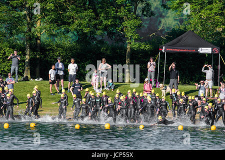 Rutland Water, UK. 17th June, 2017. Rutland Water, UK. 17th June, 2017. The third wave of competitors women) wait on the shore of the reservoir to start the 1500 meters swim phase of the Dambuster Triathlon (swim, bike and run race) at Rutland Water, England, on 17th June 2017. Credit: Michael Foley/Alamy Live News Stock Photo