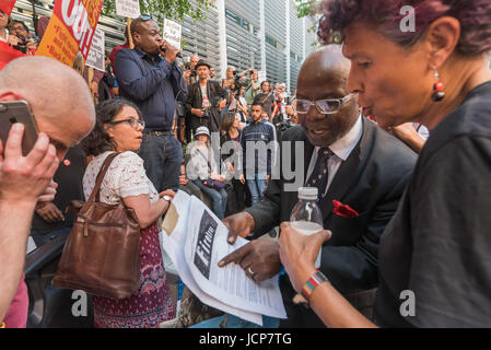 June 16, 2017 - London, UK - London, UK. 16th June 2017. A local councillor for North Kensington shows Moyra Samuels a letter warning the Grenfell Tower was a firetrap at the rally outside the Department for Communities and Local Government calling for urgent action to identify those responsible for the unsafe state of Grenfell Tower which led to the horrific fire in which over 150 people were burnt to death. Speakers included Matt Wrack, Fire Brigades Union General Secretary, local residents who had witnessed the deaths, housing activists who have long called for social housing to meet the sa Stock Photo