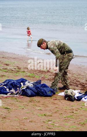 A Member of The Tigers Freefall Parachute Display Team Orders His Parachute After Landing at the 2016 Torbay Airshow. Paignton, Devon, UK. June, 2016. Stock Photo