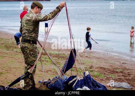 A Member of The Tigers Freefall Parachute Display Team Orders His Parachute After Landing at the 2016 Torbay Airshow. Paignton, Devon, UK. June, 2016. Stock Photo