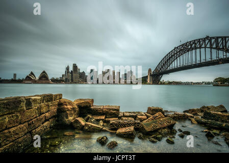 Skyline of Sydney downtown  with Harbour Bridge, NSW, Australia. Long exposure. Stock Photo