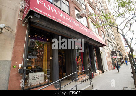 row of shops selling furs in fashion district New York City USA Stock Photo