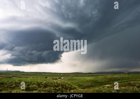 A supercell thunderstorm over a field in the Colorado plains near Wellington Stock Photo