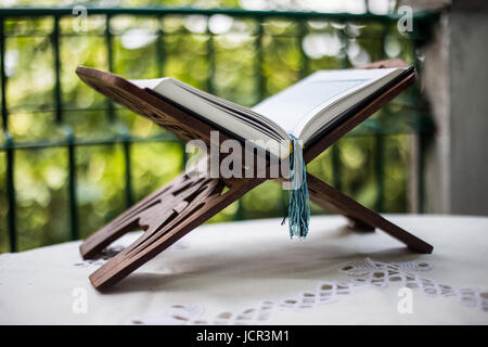 Quran-holy book of Muslims, an open book on a stand with rosary Stock Photo