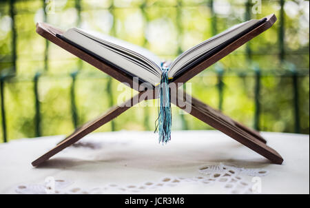 Quran-holy book of Muslims, an open book on a stand with rosary Stock Photo