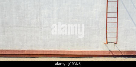 Element of building facade with fire escape. White plaster wall texture. Mockup template. Empty wall blank space. Panorama Stock Photo