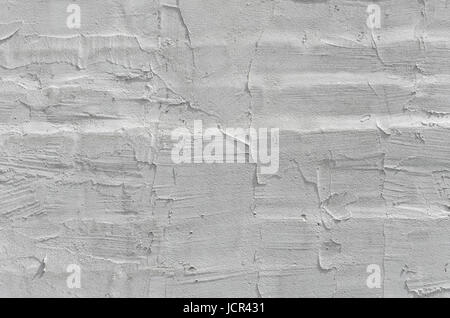 Thin layer of plaster on a brick wall. Gray plaster wall texture. Empty background Stock Photo