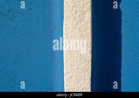 Blue plaster wall texture with white vertical stripe . Empty plaster background Stock Photo