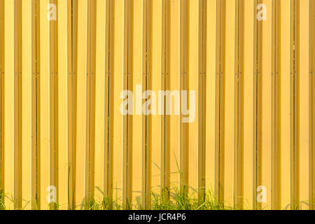Yellow corrugated metal texture. Empty wall background Stock Photo
