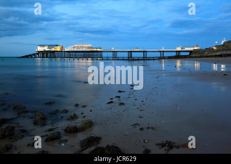 The pier illuminated at dusk, Cromer, North Norfolk, England, Europe Stock Photo