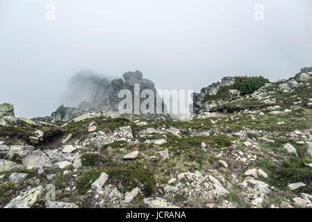 Mountain landscape on a cloudy day with rain clouds and fog on the peaks. Tatra Mountains. Stock Photo