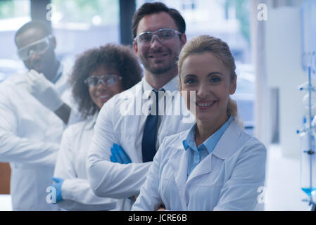 Mix Race Scientists Team Happy Smiling Working In Laboratory Doing Research, Man And Woman Making Scientific Experiments Doctors In Lab Stock Photo