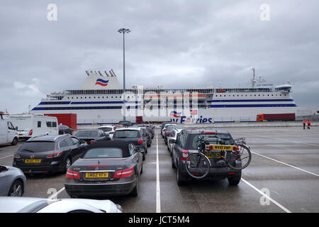 Vehicles queueing waiting to board Brittany Ferries Cap Finistere ferry at Bilbao Port in Spain. Stock Photo